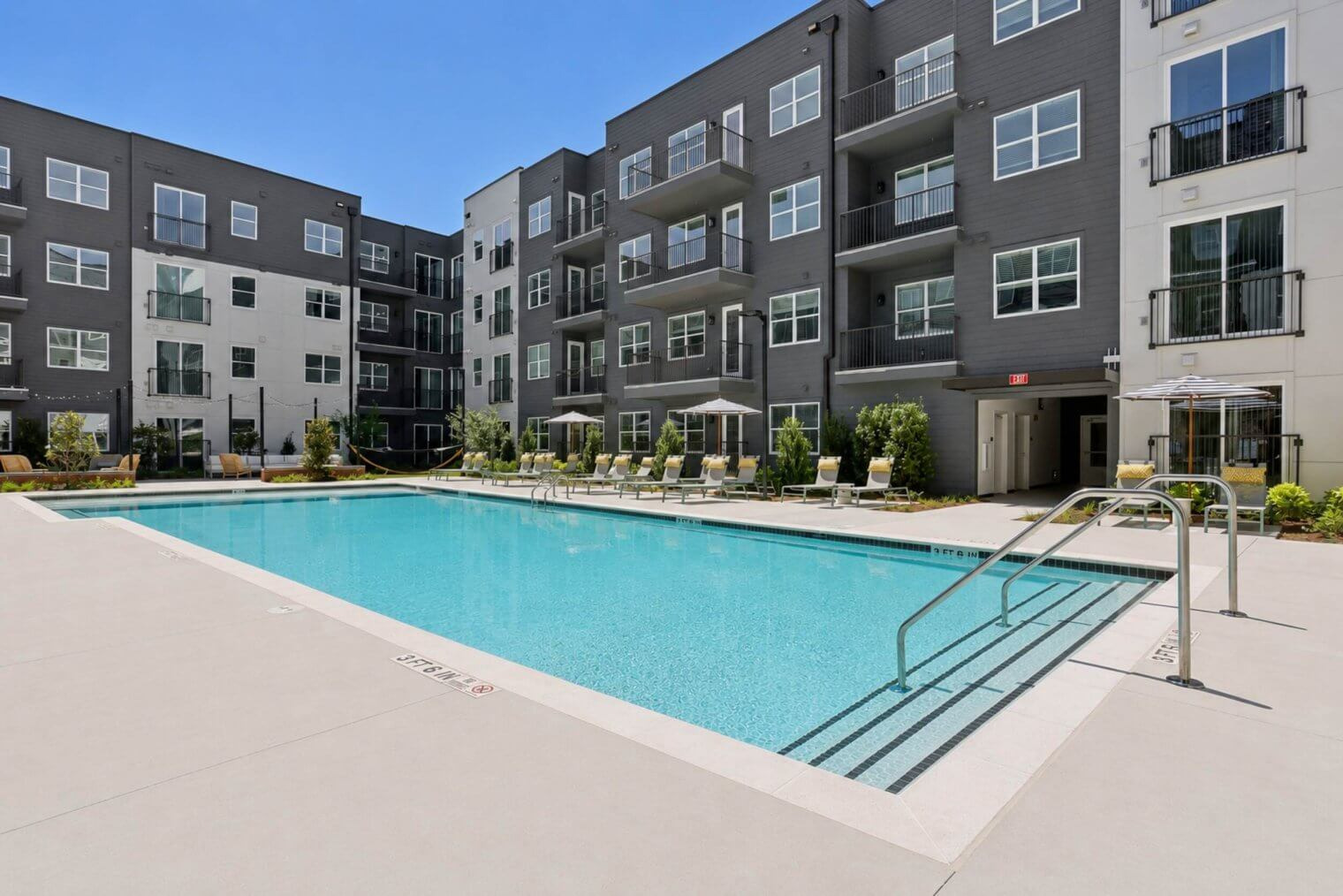 The Garrison swimming pool and apartment buildings.