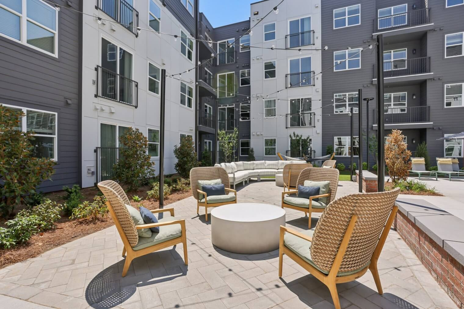 Lounge seating and fire pit in The Garrison courtyard.